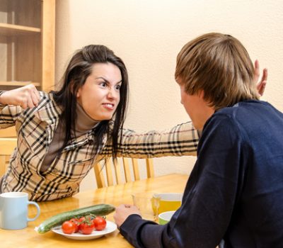 Wife quarrels with her husband in the kitchen