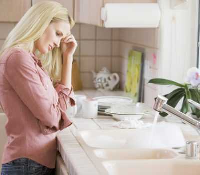 Woman Frustrated At Kitchen Counter